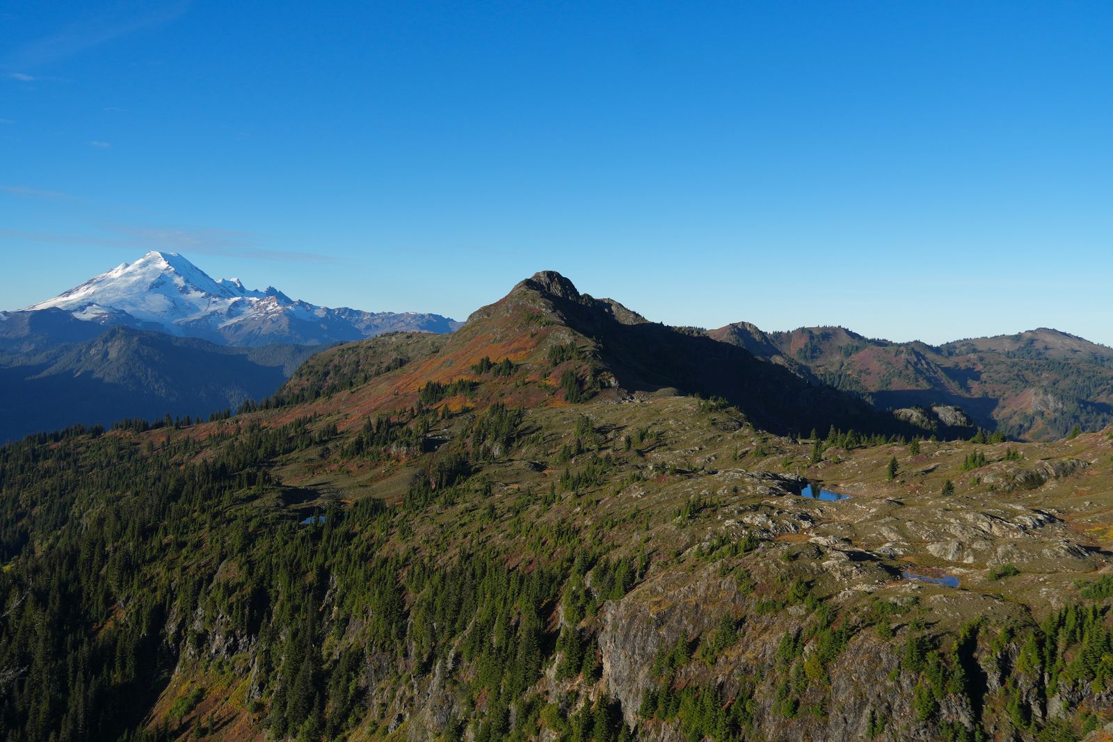 Mount Baker beyond a rocky ridge and small tarns, Yellow Aster Butte