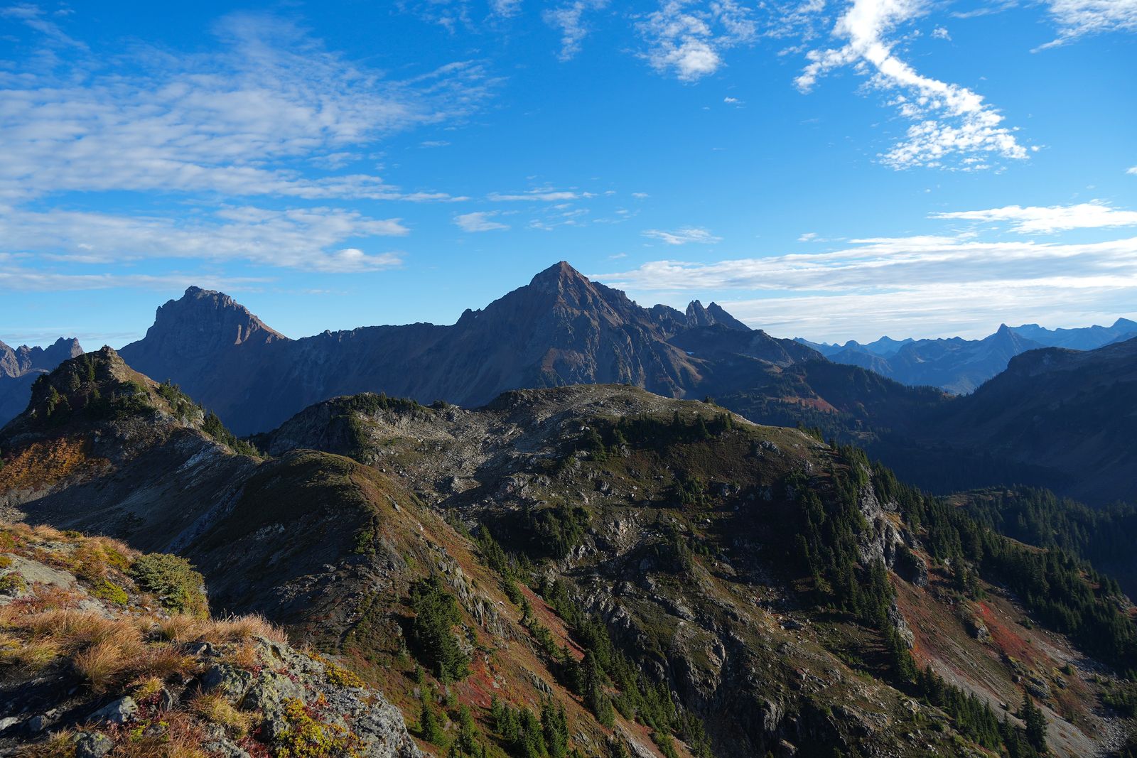 Jagged mountain ridge above rocky slopes with fall colors, Yellow Aster Butte