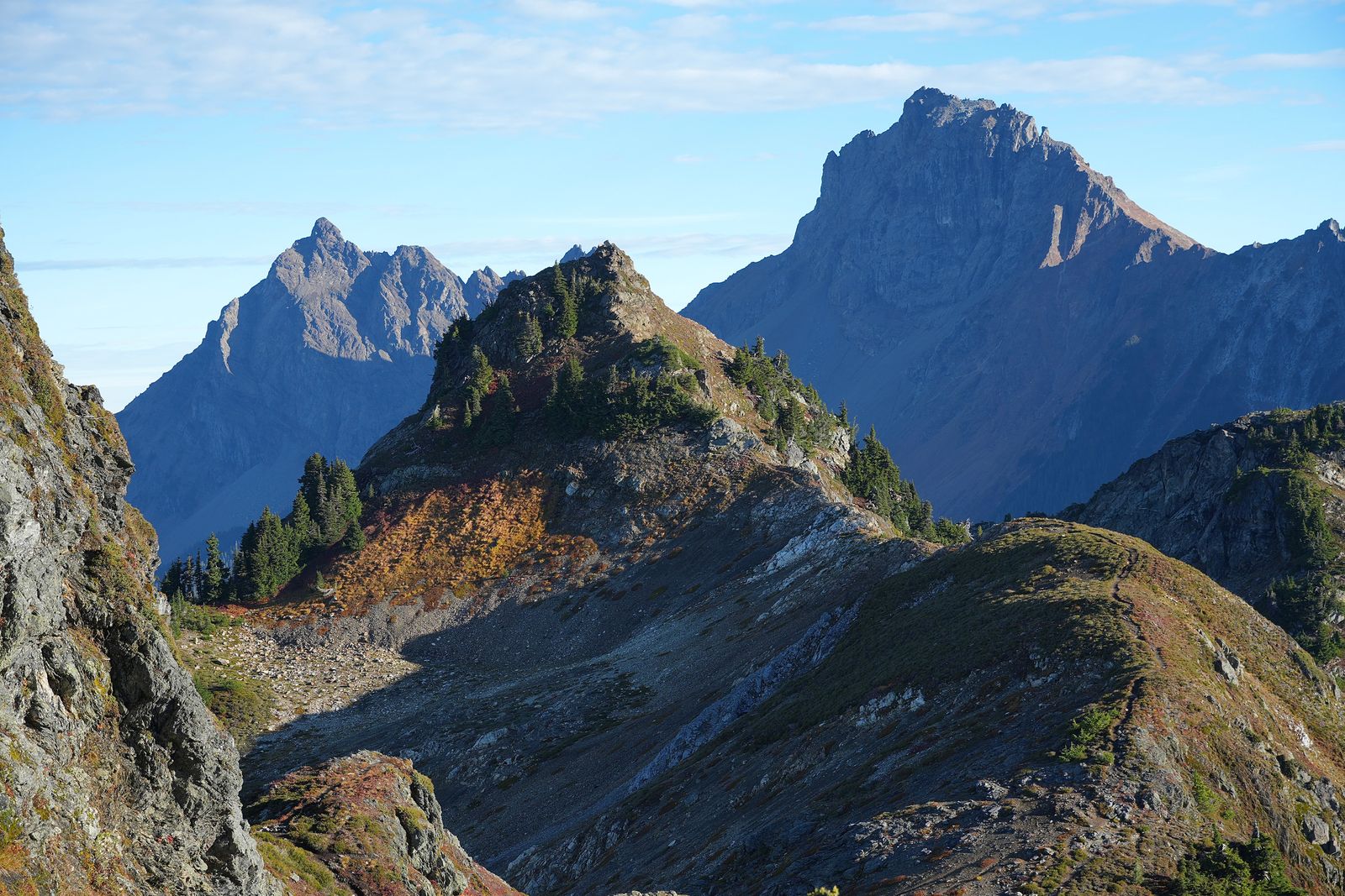 Rocky mountain ridges beyond a narrow ridge trail, Yellow Aster Butte