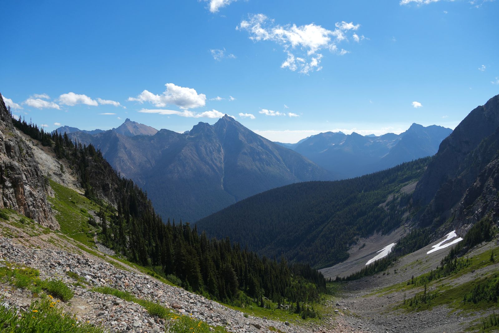North Cascades peaks above a forested valley and rocky slopes, Washington Pass