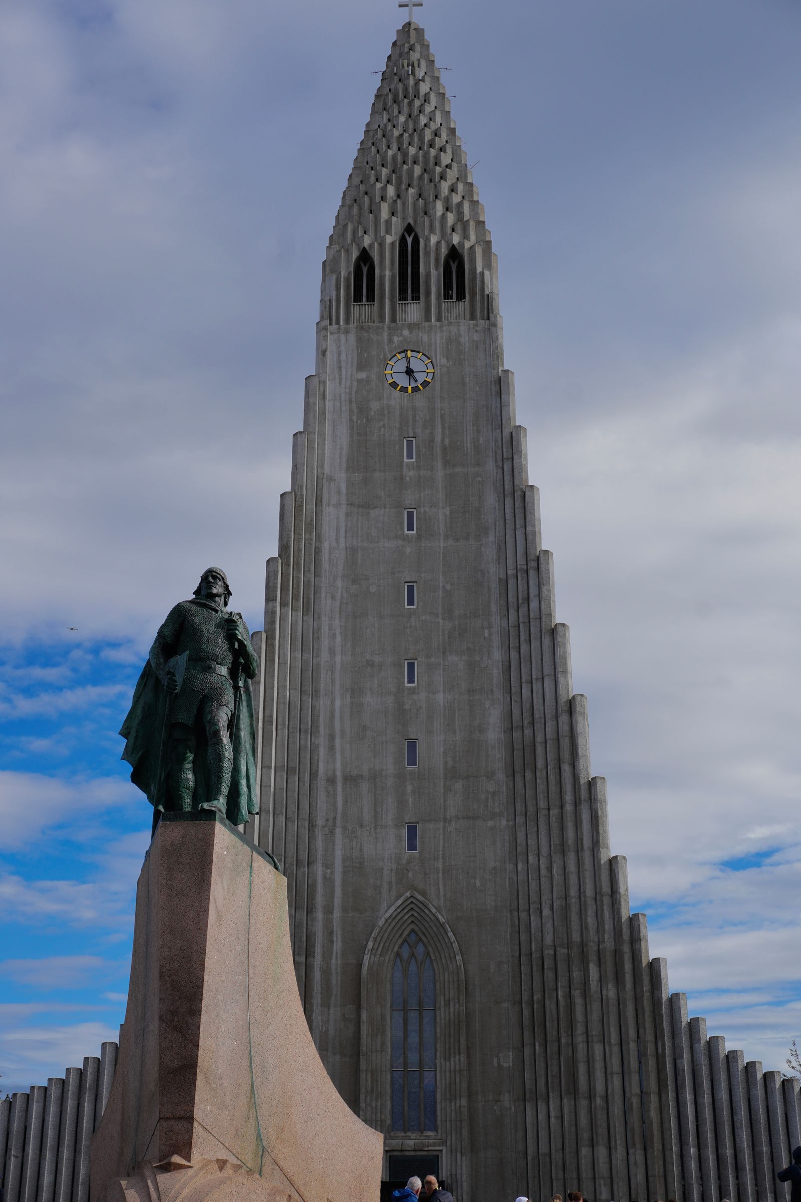 Church tower behind a statue in Reykjavik