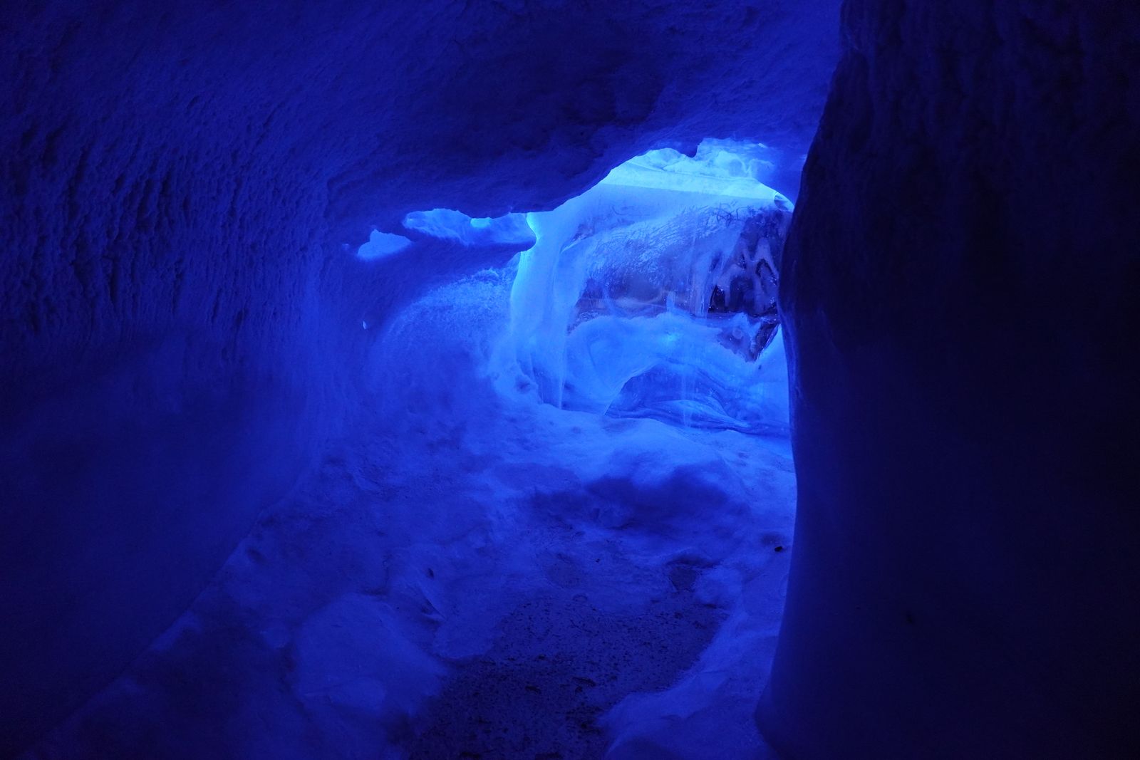 Ice cave passage under blue light, Reykjavik