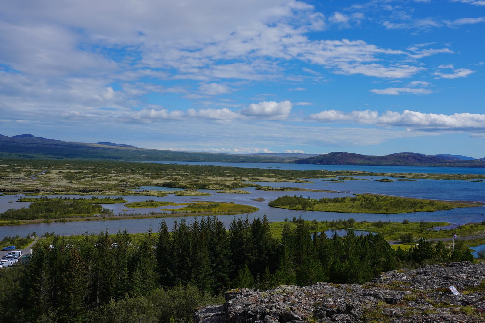 Lake surrounding green islands below low hills, Bláskógabyggð