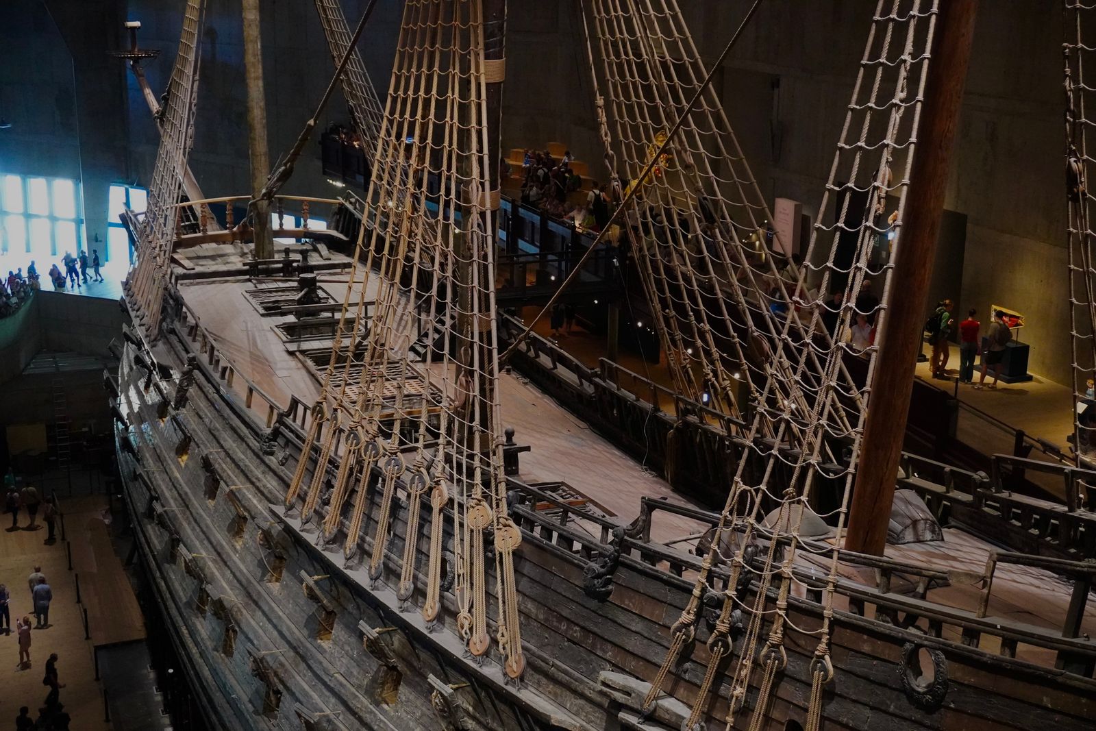 Wooden sailing ship with tall masts and rigging displayed indoors, Stockholm