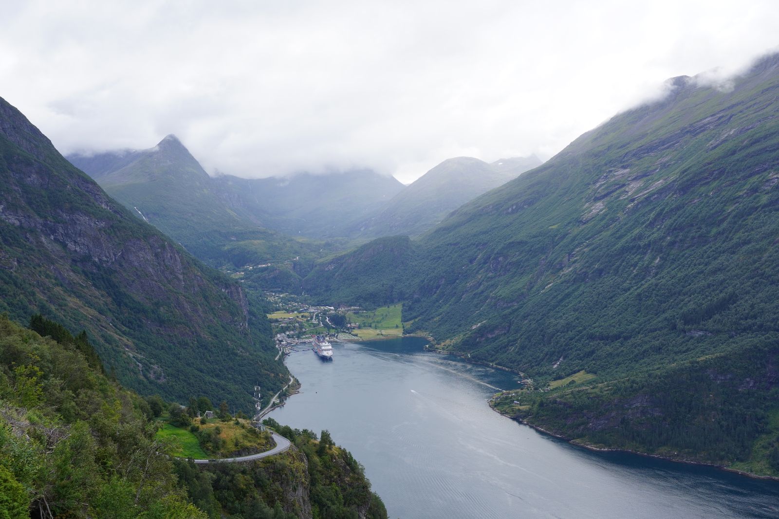 Fjord beside Geiranger village and a winding road