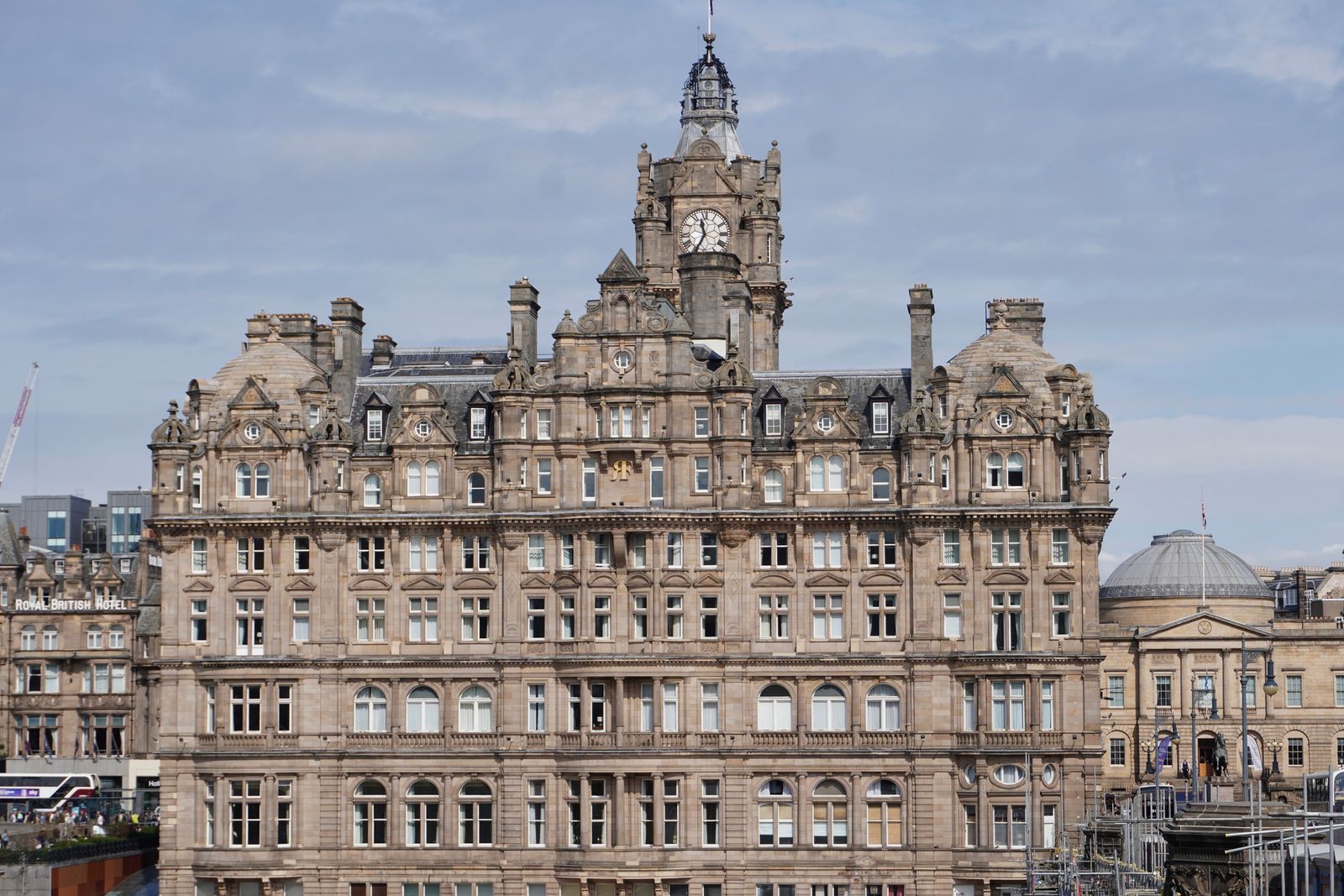 Stone building with a clock tower beside a domed roof, Edinburgh Town
