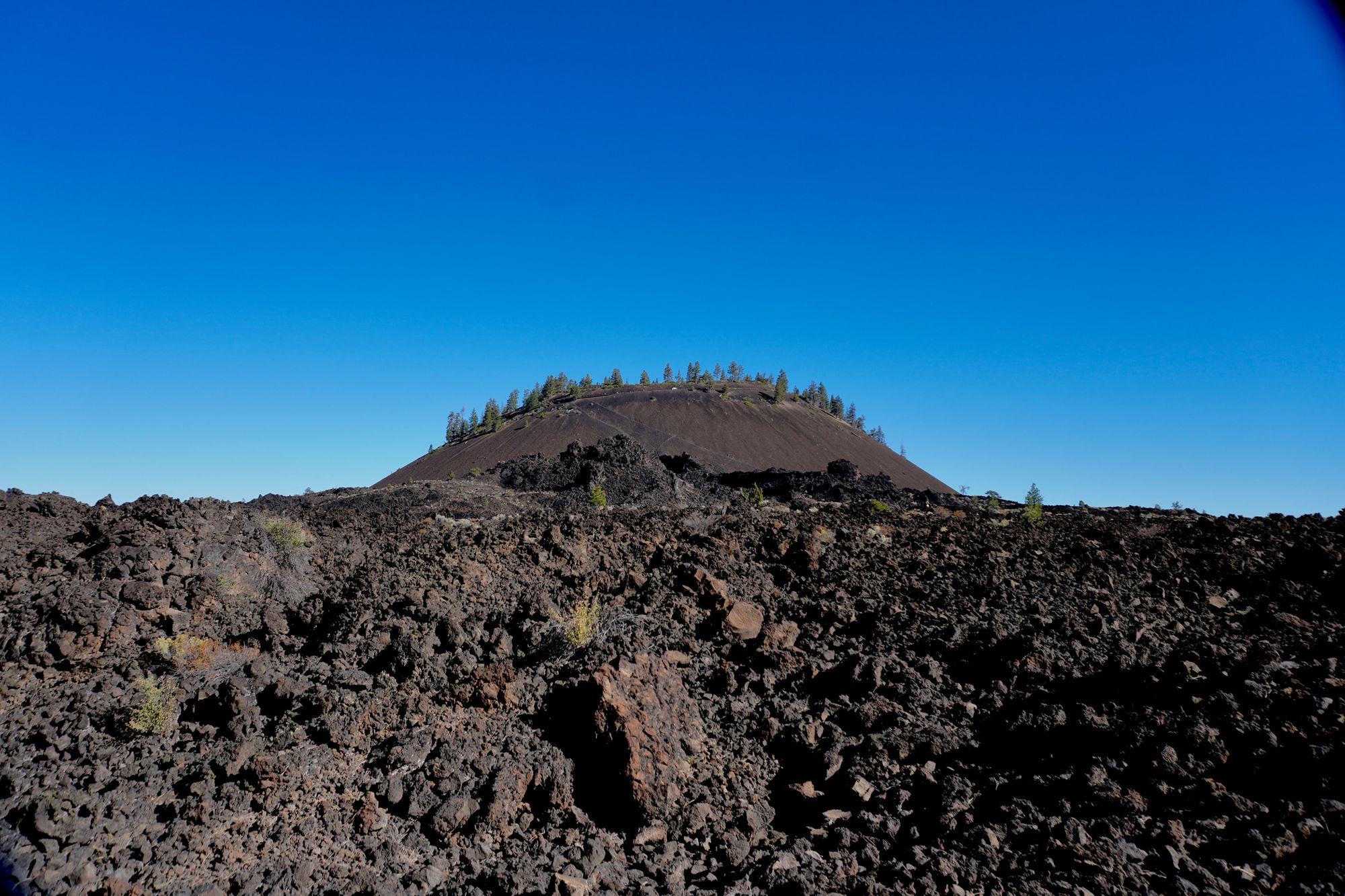 Lava Butte in Oregon above jagged dark rocks