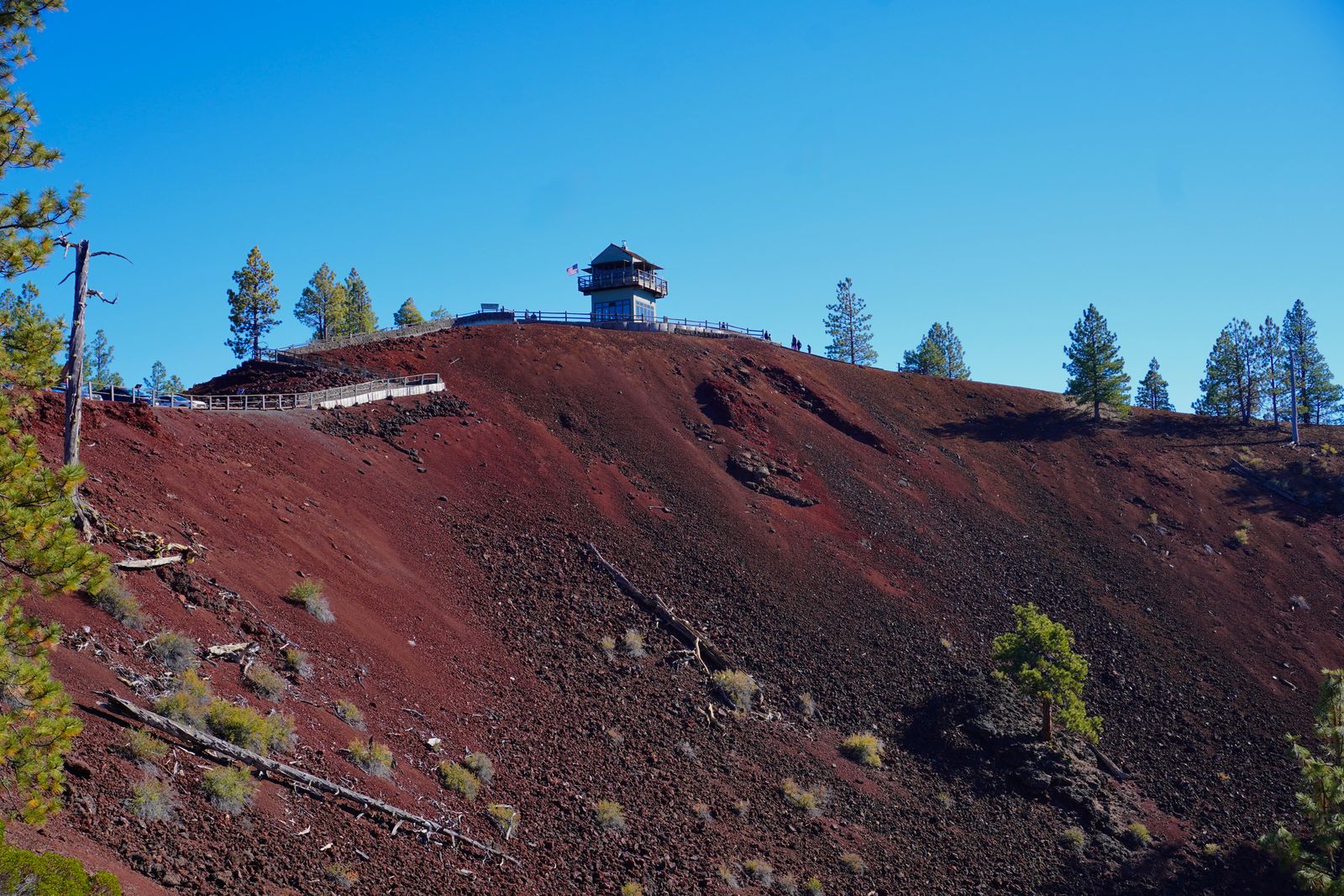 Lava Butte Oregon with red slopes and a lookout tower