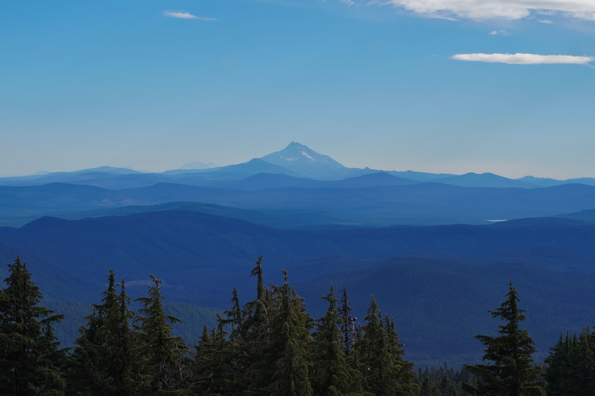 Mount Hood above layered forested ridges