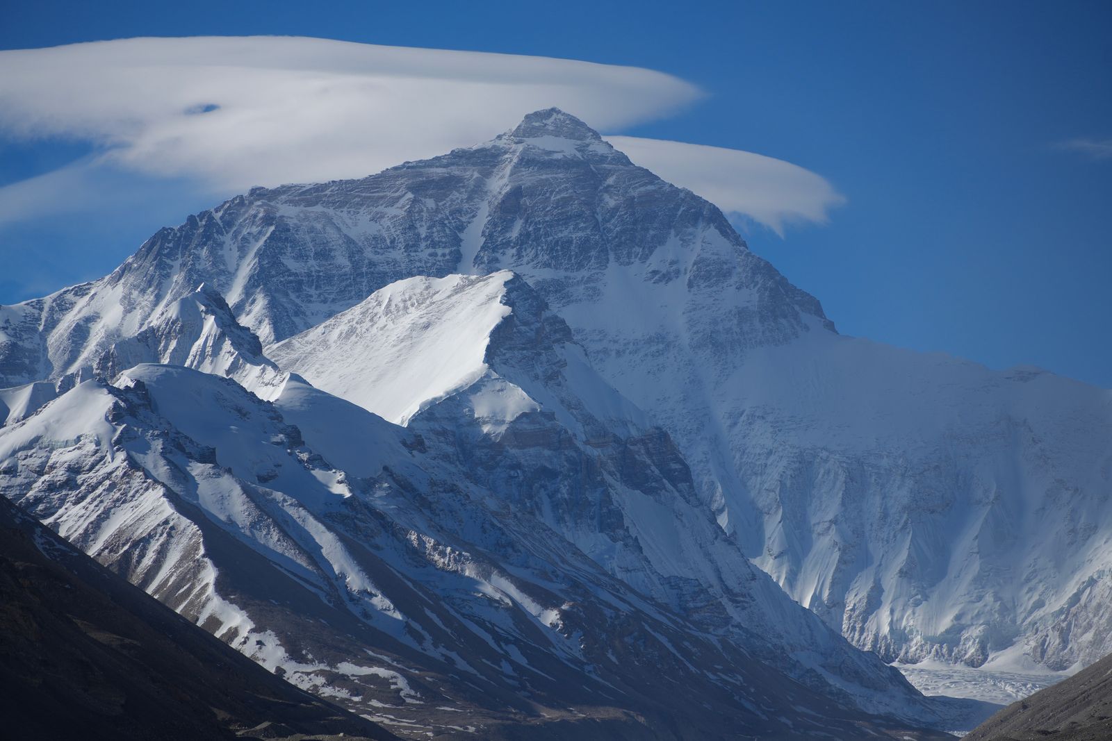 Mount Everest above snowy ridges and a glacier