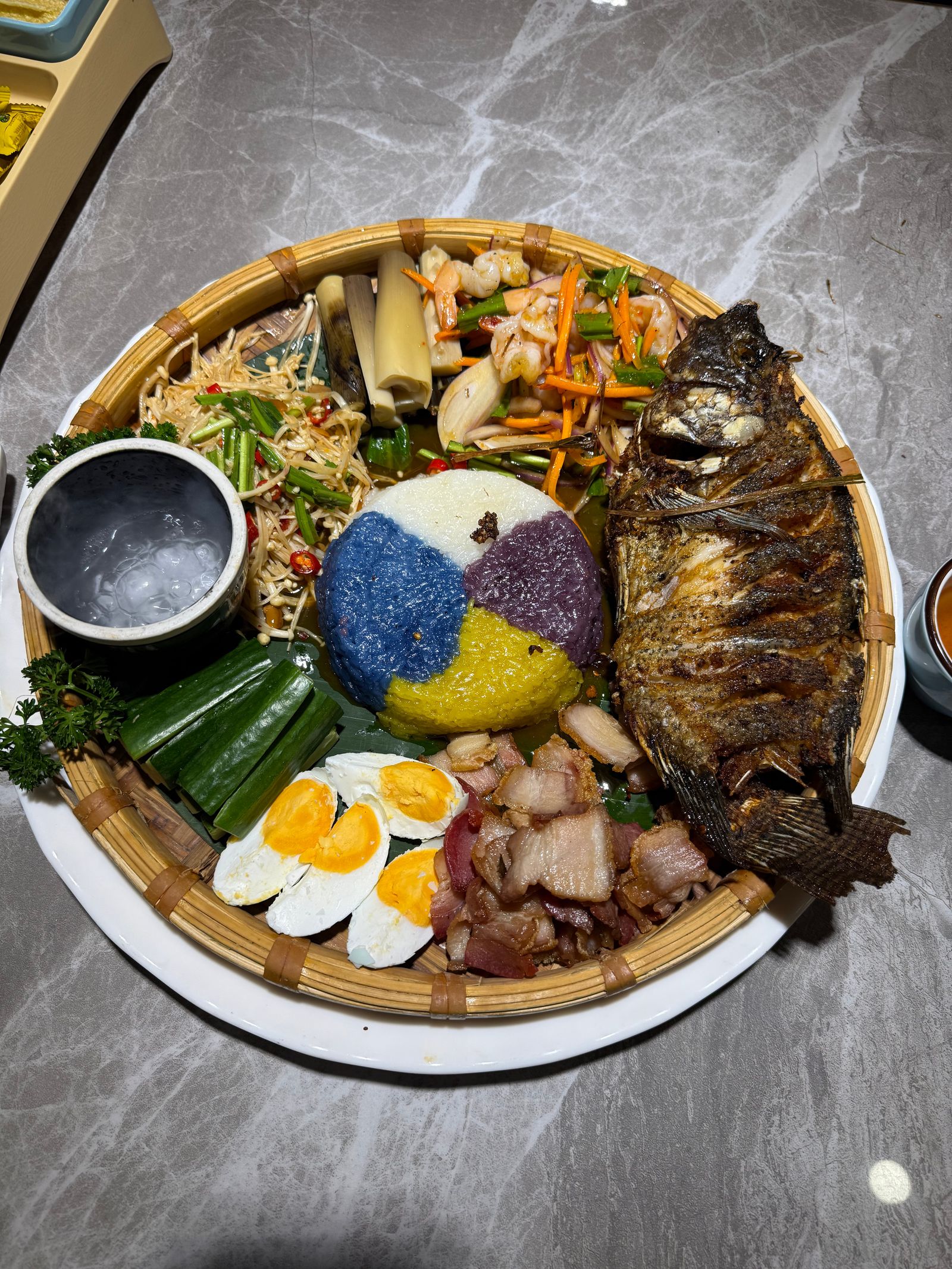 Cooked fish, rice, eggs and vegetables in a woven tray, Tiger Leaping Gorge