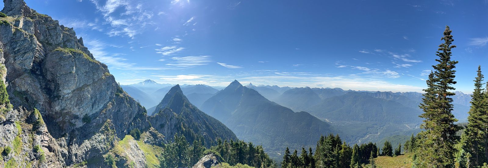 Rocky peaks beyond a steep rock face, Cascades